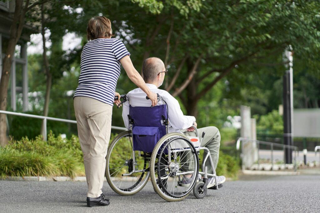 Family supporting the elderly in wheelchairs