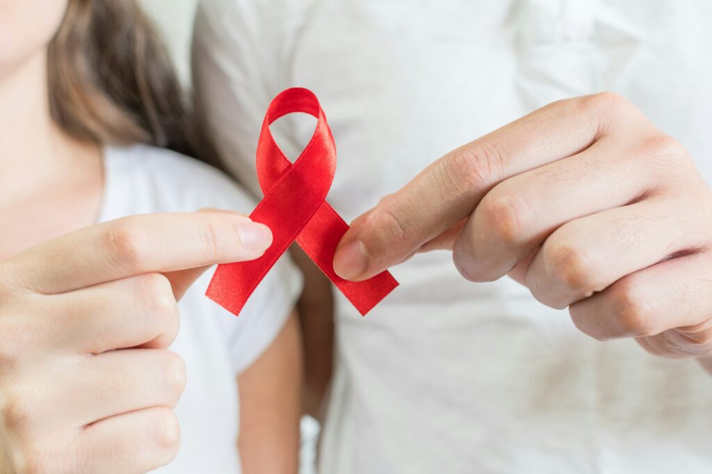 Red ribbon is the universal symbol of awareness and support for people living with HIV